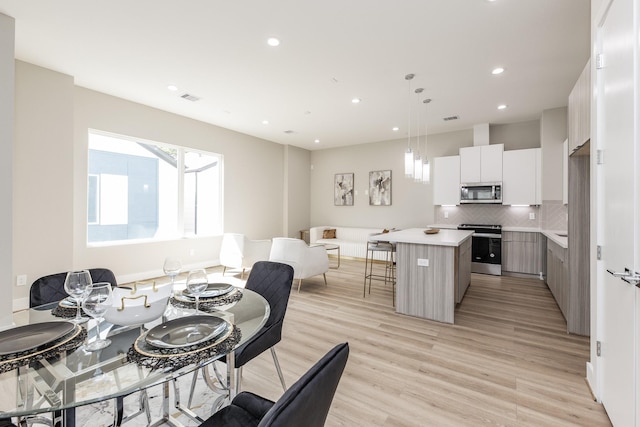 dining area featuring light hardwood / wood-style flooring