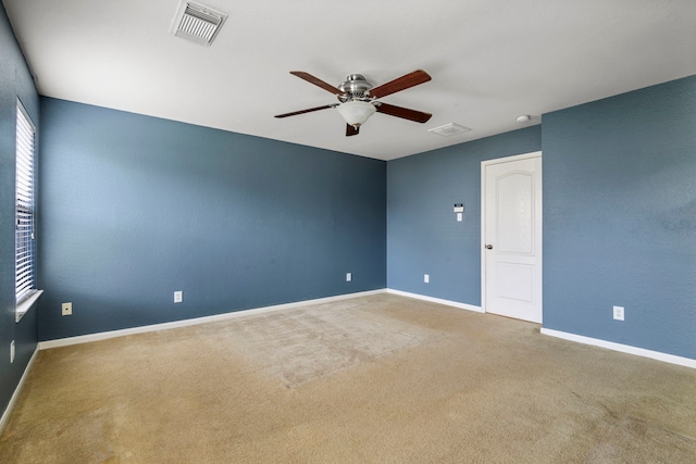 carpeted empty room with ceiling fan