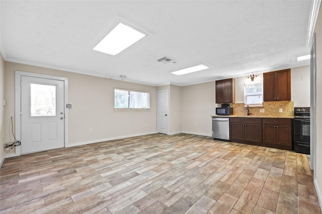 kitchen with stove, light wood-type flooring, backsplash, stainless steel dishwasher, and sink