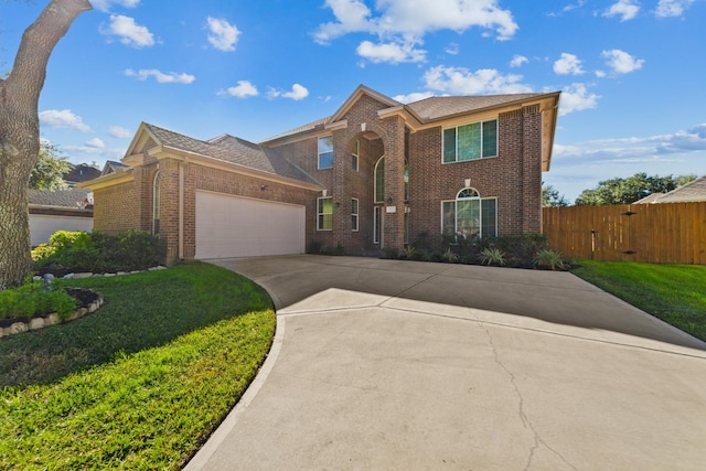 view of front facade featuring a garage and a front lawn