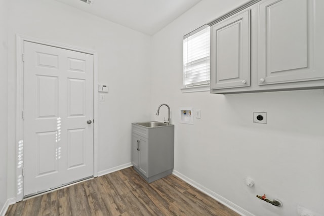 laundry area with sink, cabinets, electric dryer hookup, hookup for a gas dryer, and hookup for a washing machine