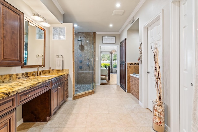 bathroom featuring tile patterned flooring, vanity, separate shower and tub, and crown molding