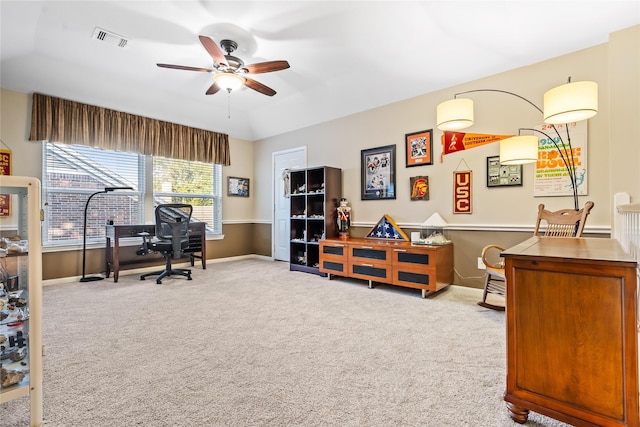 home office with light carpet and ceiling fan