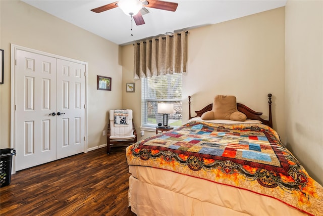 bedroom featuring ceiling fan, a closet, and dark wood-type flooring