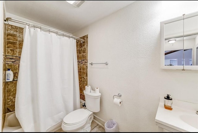 full bathroom featuring vanity, shower / bath combo, and toilet