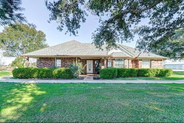 ranch-style house with a front yard