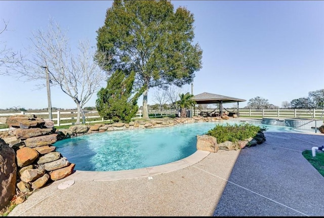 view of pool featuring a gazebo and a patio