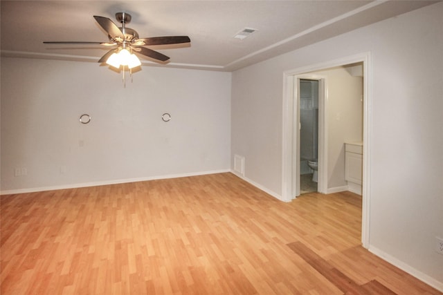 empty room featuring light hardwood / wood-style flooring and ceiling fan