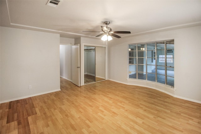 spare room featuring ceiling fan and light hardwood / wood-style flooring