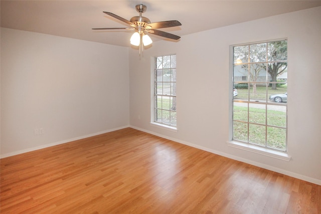 spare room with ceiling fan and light hardwood / wood-style floors