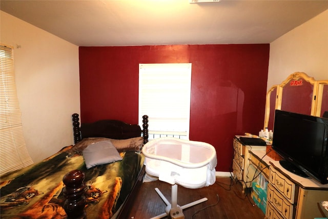 bedroom featuring dark hardwood / wood-style flooring