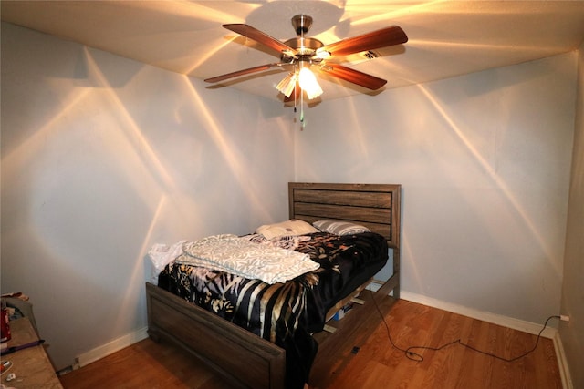 bedroom featuring ceiling fan and hardwood / wood-style floors