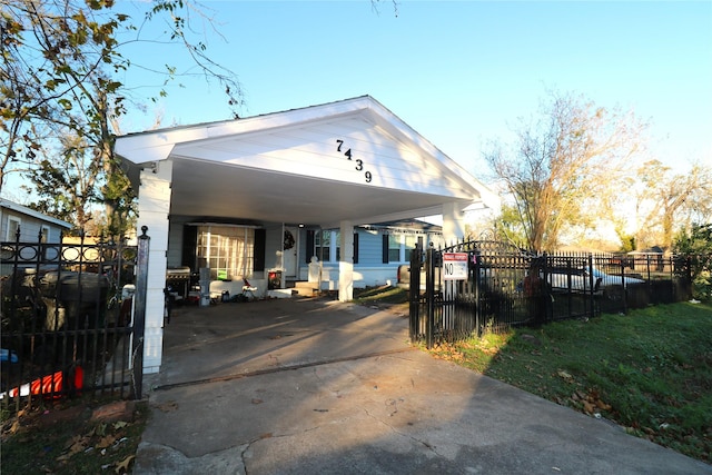 view of front of property featuring a carport