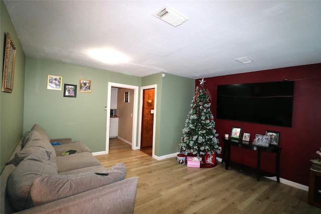 living room with wood-type flooring