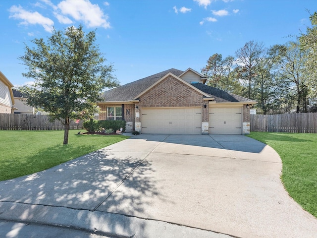 view of front of home featuring a front lawn and a garage