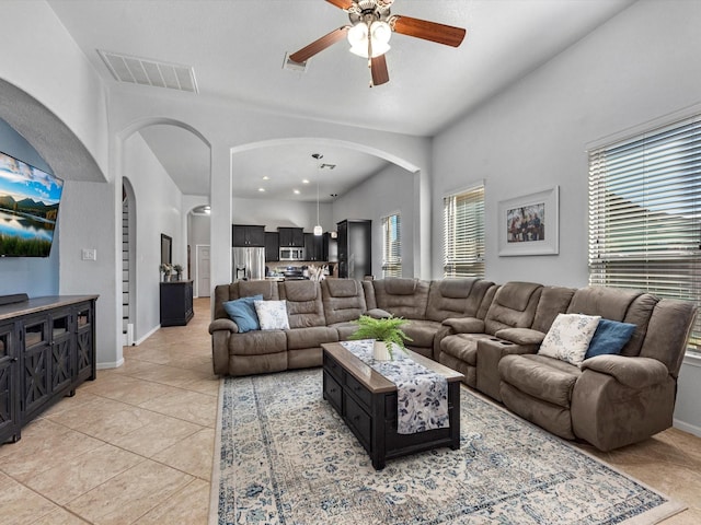 tiled living room featuring ceiling fan