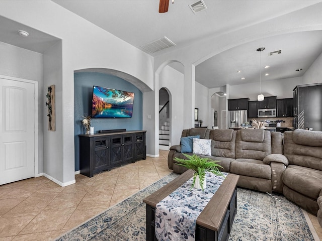 living room featuring ceiling fan and light tile patterned floors