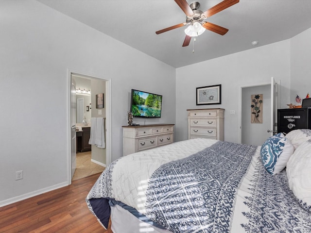 bedroom with connected bathroom, ceiling fan, and hardwood / wood-style floors