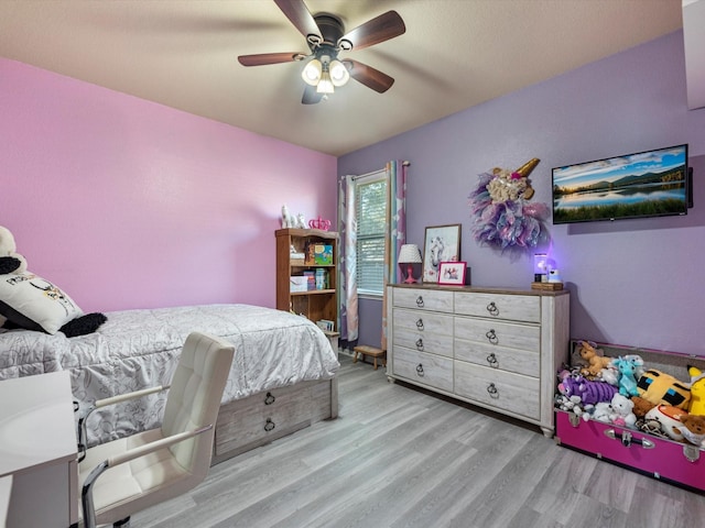 bedroom featuring ceiling fan and light hardwood / wood-style flooring