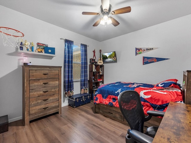 bedroom featuring hardwood / wood-style flooring and ceiling fan