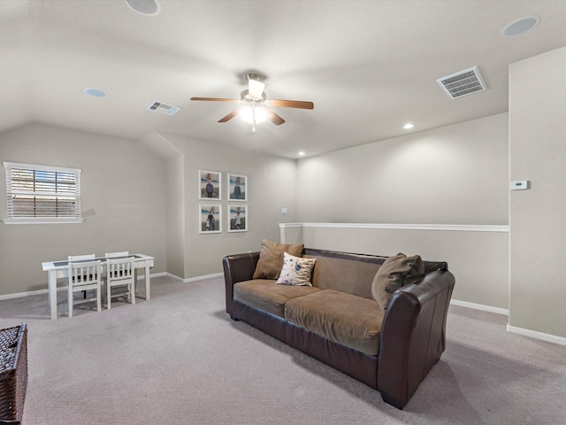 carpeted living room with vaulted ceiling and ceiling fan