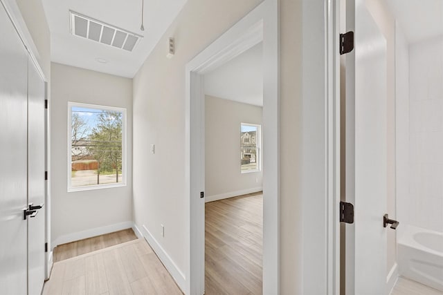 corridor featuring light hardwood / wood-style flooring