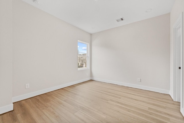 empty room with light hardwood / wood-style floors