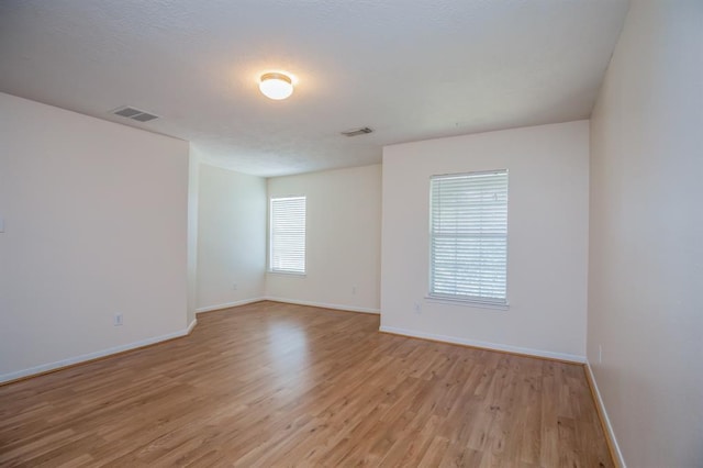 empty room with light wood-type flooring