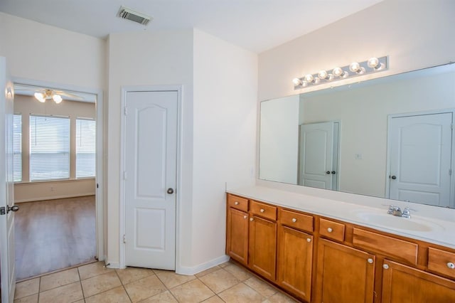 bathroom featuring tile patterned flooring, ceiling fan, and vanity