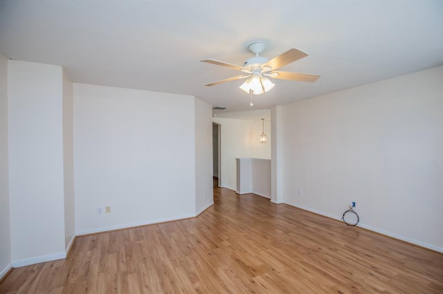 spare room featuring ceiling fan and light wood-type flooring