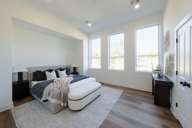 bedroom with hardwood / wood-style floors