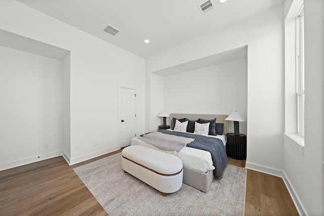 bedroom featuring dark hardwood / wood-style flooring