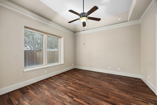 empty room featuring dark hardwood / wood-style floors, ceiling fan, and ornamental molding