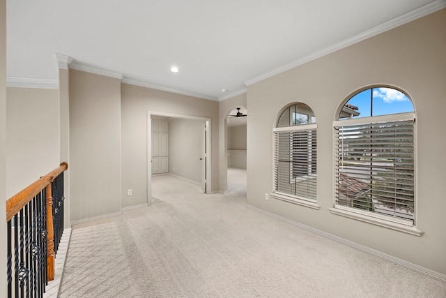 carpeted spare room with ornamental molding