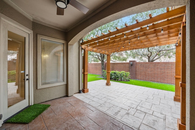 view of patio / terrace with a pergola and ceiling fan