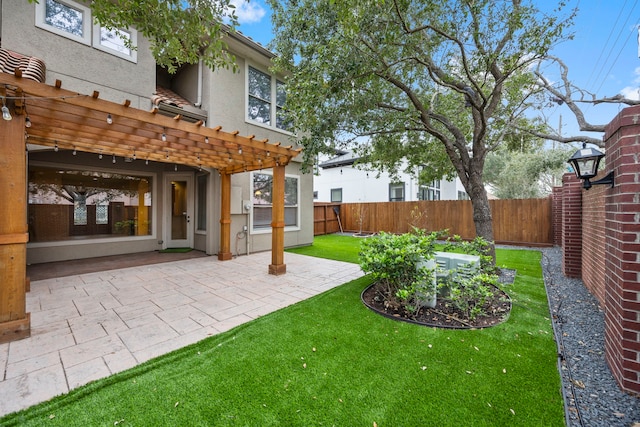 view of yard with a pergola and a patio