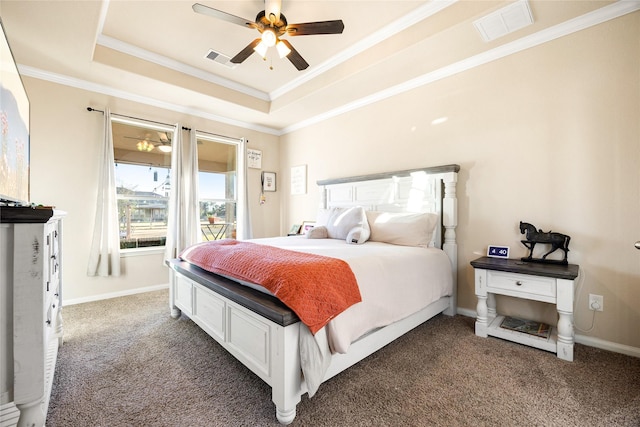 carpeted bedroom with ceiling fan, crown molding, and a raised ceiling