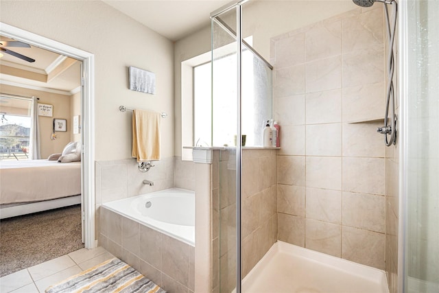 bathroom featuring independent shower and bath, tile patterned flooring, and ornamental molding