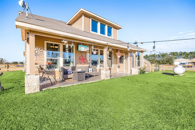 back of house with a patio area and a yard