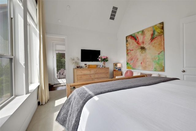 carpeted bedroom with vaulted ceiling