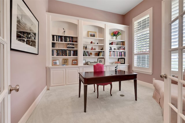 office area featuring french doors and light colored carpet