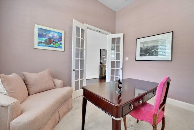 carpeted office featuring french doors