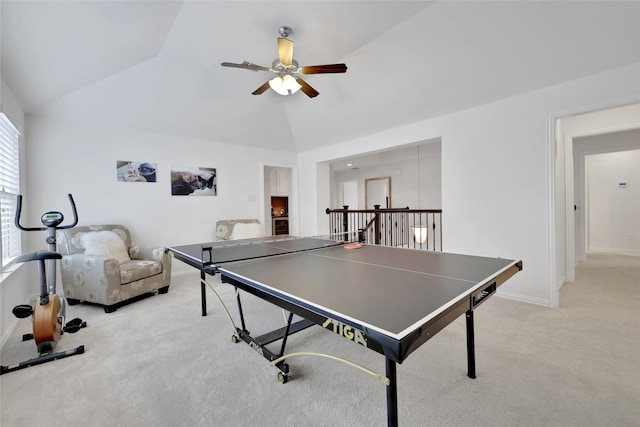 rec room with ceiling fan, lofted ceiling, and light carpet