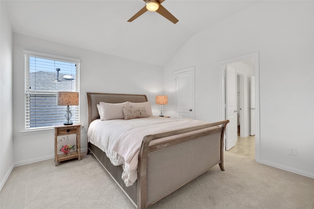 bedroom with ceiling fan, light colored carpet, and vaulted ceiling