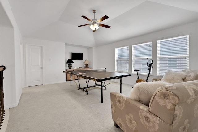 playroom featuring light colored carpet, a raised ceiling, ceiling fan, and lofted ceiling