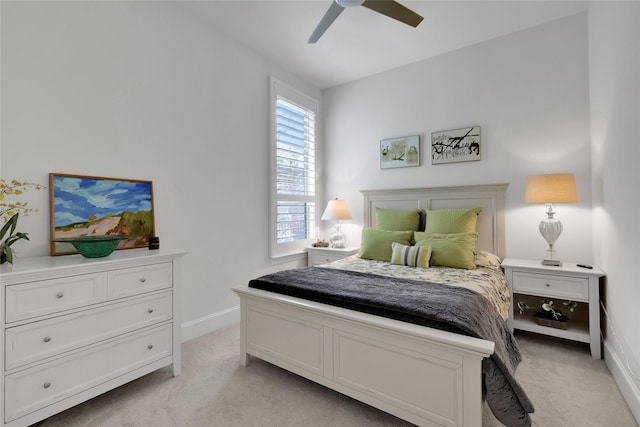 bedroom with light colored carpet and ceiling fan