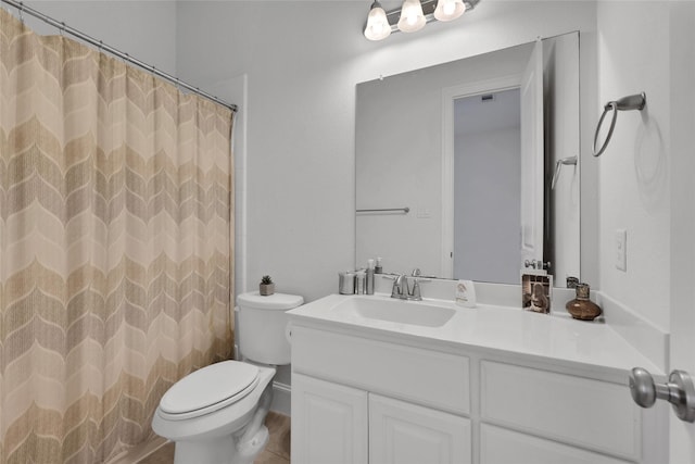 bathroom featuring walk in shower, vanity, and toilet