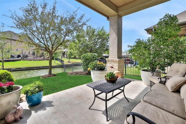 view of patio with a water view