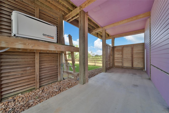 view of patio / terrace featuring an AC wall unit