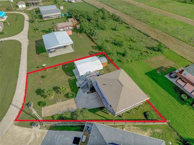 birds eye view of property featuring a rural view